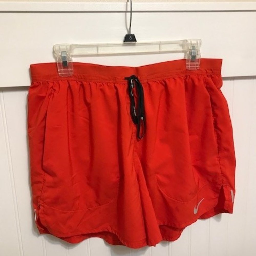 RED Nike Dri-fit running shorts (outside zipper pocket and inside pocket)